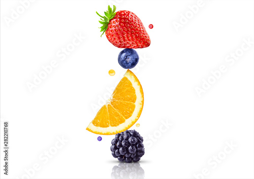 Fototapeta Naklejka Na Ścianę i Meble - A stack of fresh ripe summer fruits and berries isolated on white background. Blackberry, orange, blueberry, strawberry fruit stack in a row. Healthy life, balanced diet composition design concept