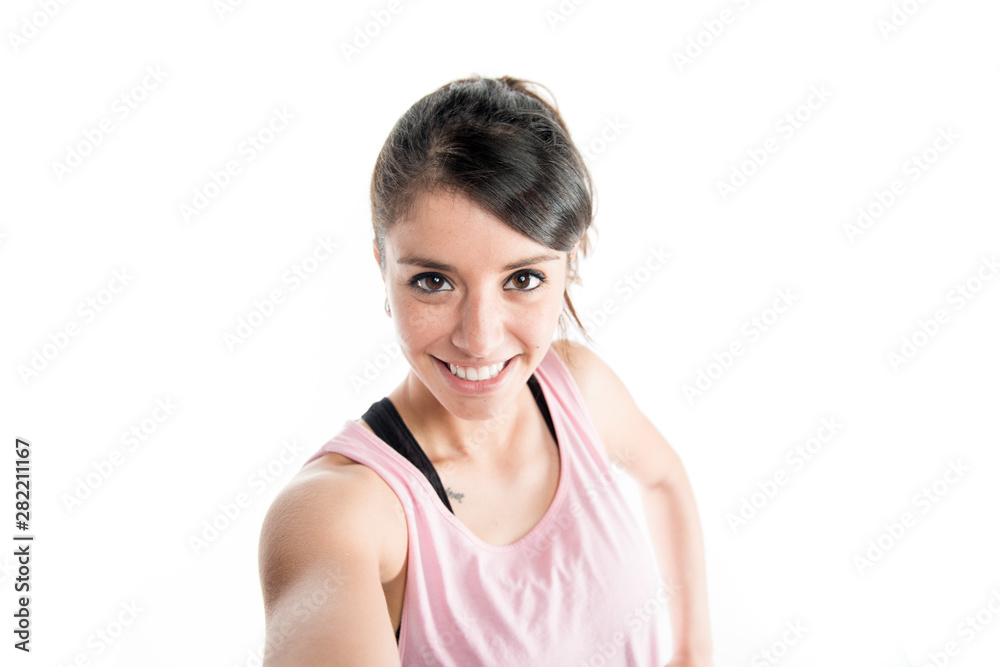 Young woman selfie portrait wearing sport wear on a white background studio shoot Young woman selfie portrait wearing sport wear on a white background studio shoot