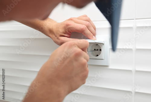 The process of installation of electrical sockets by electrician