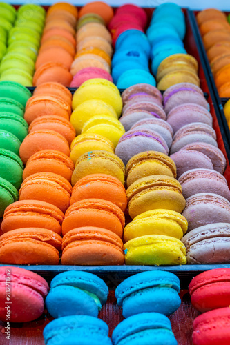 Vertical photo of colorful French macaron cake selling at bakery
