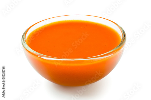 Peri peri chilli sauce in a glass bowl isolated on white. photo