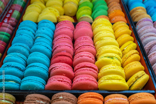 Multicolored French macaroons cake in tray for sale at patisserie