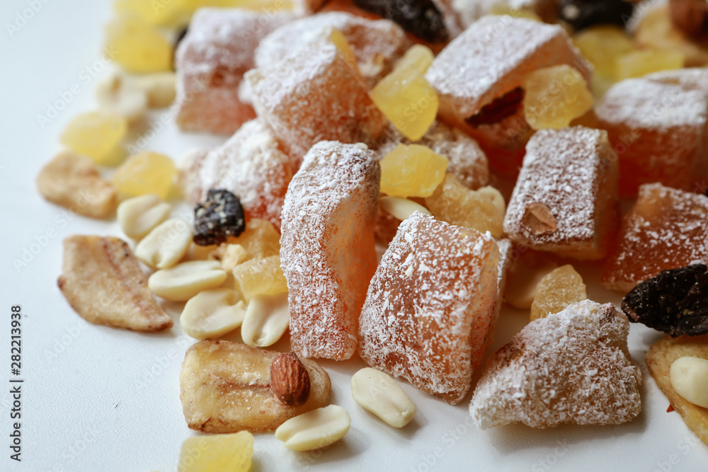 Turkish delight, nuts, dried fruits are mixed on the table Turkish delight, nuts, dried fruits are mixed on the table