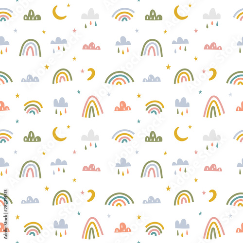 Minimalistic scandinavian style baby theme seamless background. Hand drawn rainbow with clouds and moon in pastel colors. Simple doodle elements for baby room, farbic and textile print template photo