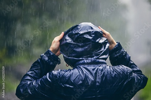 Traveler in heavy rain photo