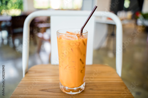 Thai milk tea in the glass with straw