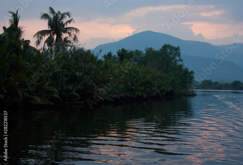 Trees and mountains during a beautiful sunset near Kampot in Cambodia