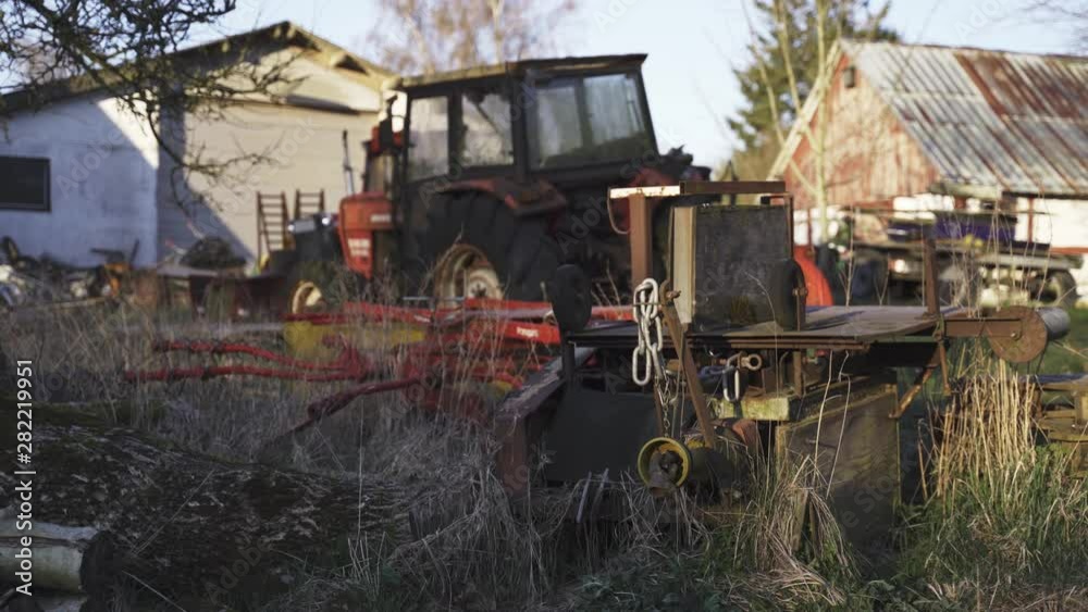 Tractor and agricultural machinery are standing on the farm for a long time without movement. 4K Tractor and agricultural machinery are standing on the farm for a long time without movement. 4K
