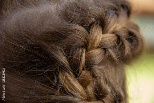 braid on the girl’s head. Braided braid from hair. Girl hairstyle.
