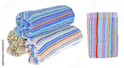 Set. Three rolled terry towels. Striped towels. Different colors. Isolated image on white background. Front view.