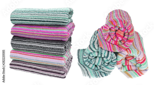 Set. Three rolled terry towels. Striped towels. Different colors. Isolated image on white background. Front view.