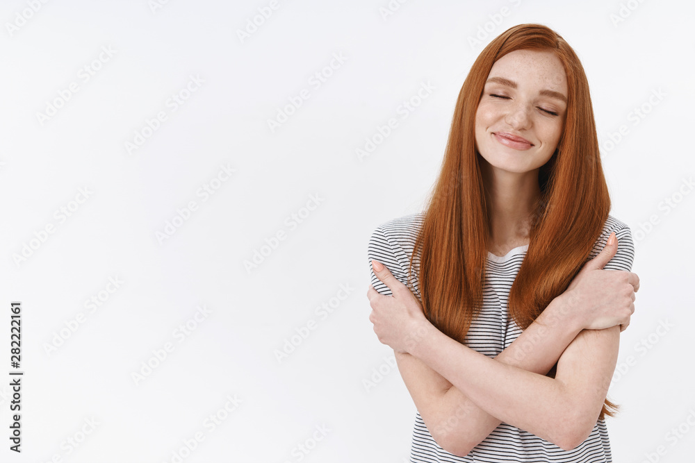 Dreamy lovely tender redhead european young woman, girlfriend dreaming sweet romantic embraces hugging herself close eyes smiling daydreaming have pleasant passionate thoughts desires Dreamy lovely tender redhead european young woman, girlfriend dreaming sweet romantic embraces hugging herself close eyes smiling daydreaming have pleasant passionate thoughts desires