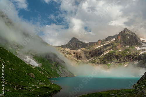 Alpine lake Klukhor with beautiful water and surrounded by mountains in the Caucasus in the Karachay-Cherkess Republic