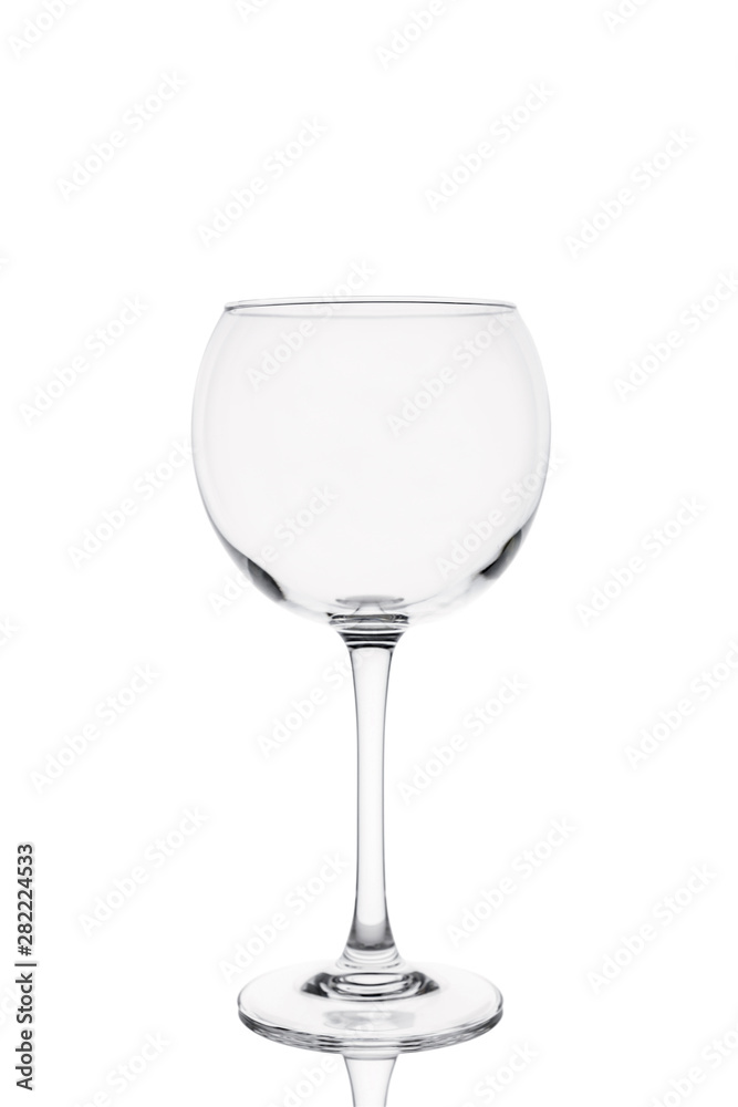 Belarus, Minsk. July 1, 2019. Isolated Martini ballon glass with reflection on white background Belarus, Minsk. July 1, 2019. Isolated Martini ballon glass with reflection on white background