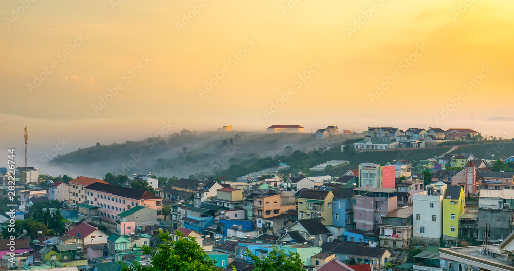 The city sinks in a beautiful morning mist to welcome the new day tropical highlands in Da Lat, Vietnam