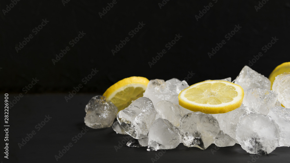 Lemons and pile of ice cubes Lemons and pile of ice cubes