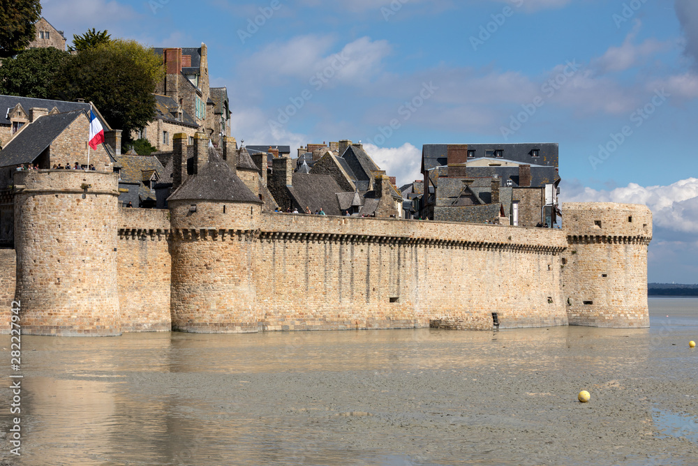  Le Mont Saint-Michel, medieval fortified abbey and village on a tidal island in the Normandy, France, at low tide