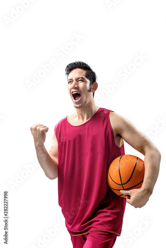 Asian man basketball player holding the ball with excited expression