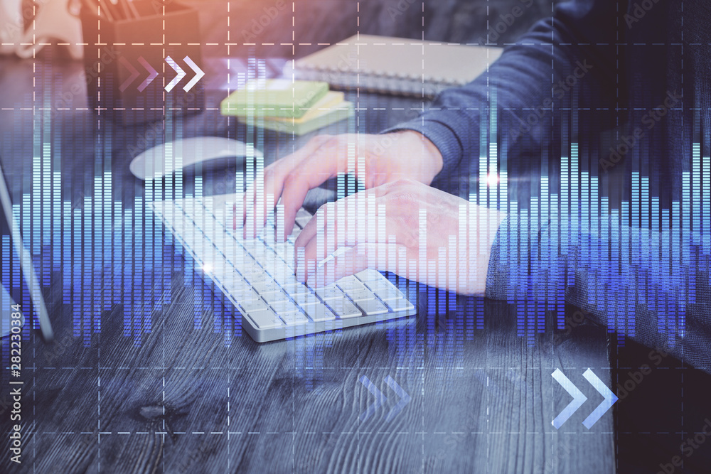 Stock graph with businessman typing on computer in office on background. Concept of analysis. Double exposure. Stock graph with businessman typing on computer in office on background. Concept of analysis. Double exposure.