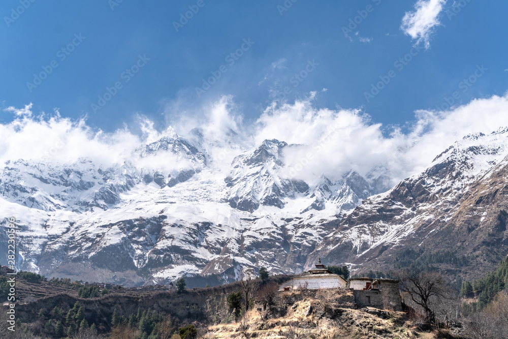 The view on Dhaulagiri peak and buddhist monastery