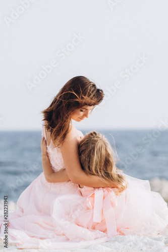 Mother and Daughter in pink dresses. Family. © Ekaterina Pichukova