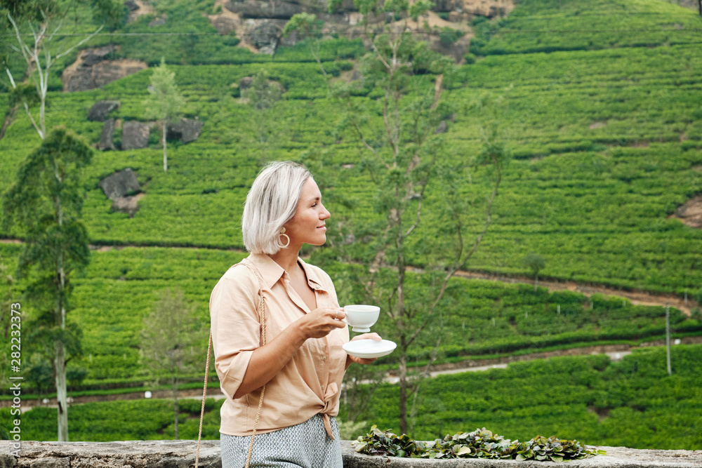 Woman with Drink Cup on Plantation Background