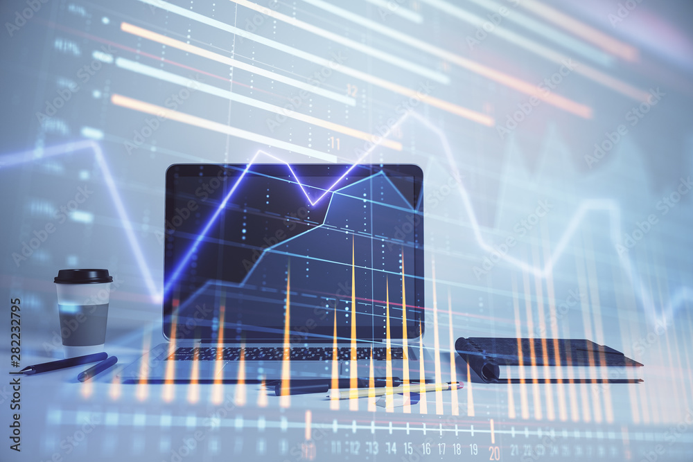 Forex graph hologram with desktop office computer background. Double exposure. Concept of financial analysis. Forex graph hologram with desktop office computer background. Double exposure. Concept of financial analysis.