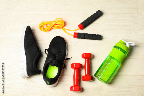 Healthy lifestyle accessories on white background, top view