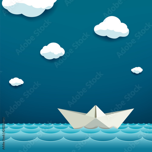 Paper boat floats on the water surface.