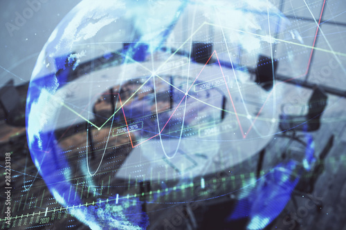 Wallpaper Mural Double exposure of stock market graph with globe hologram on conference room background. Concept of international finance Torontodigital.ca