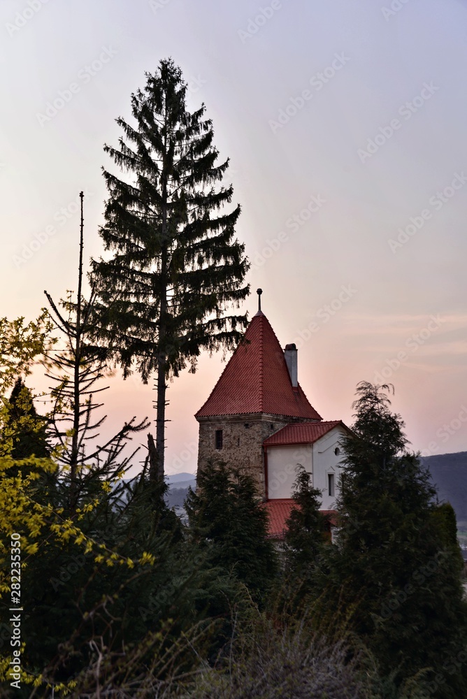 Sighisoara, Transylvania; House with typical tower , Sunset
