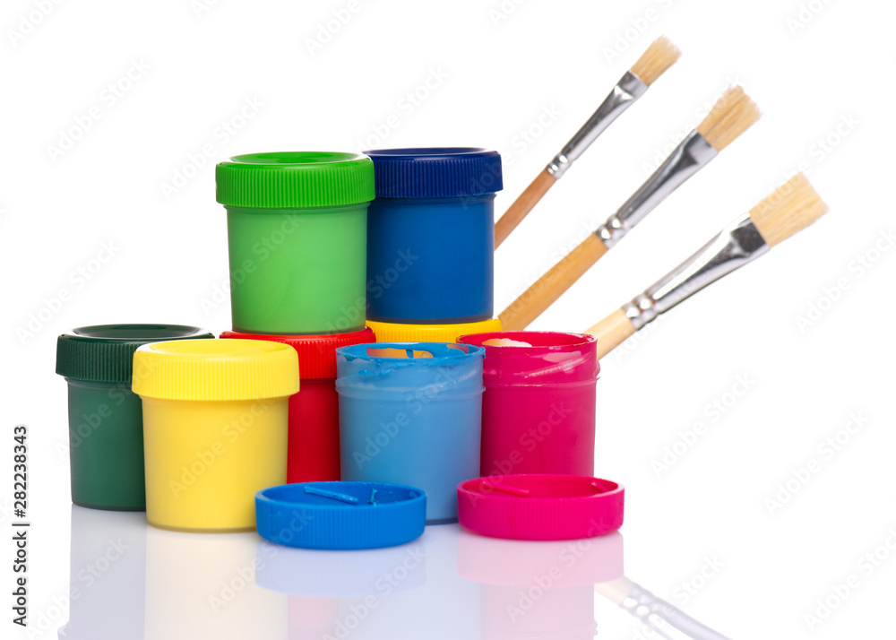 Set of Colorful Gouache jars and artist brushes isolated on white background with copy space. Cans of different colors gouache paints. Set of Colorful Gouache jars and artist brushes isolated on white background with copy space. Cans of different colors gouache paints.