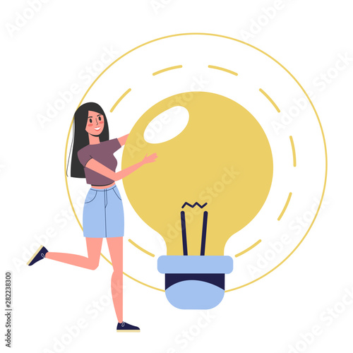 Woman standing at the big light bulb