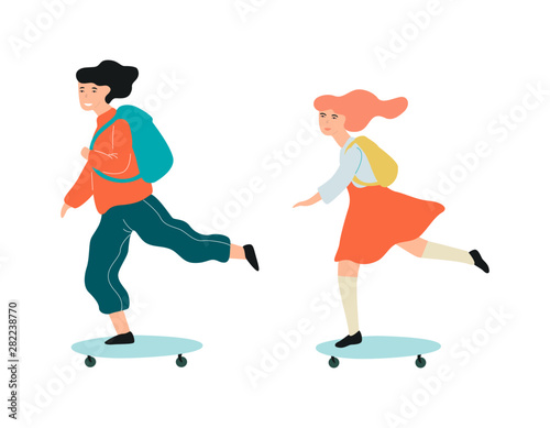 Little school kids riding on the skateboard to the school