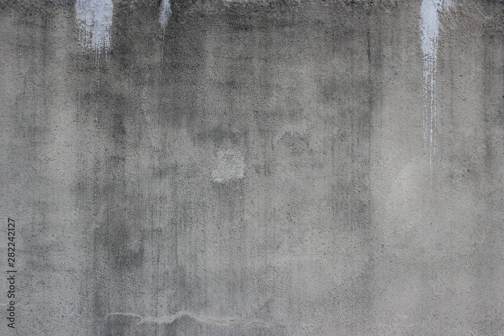 Obraz premium Weathered concrete wall with white paint stains background texture