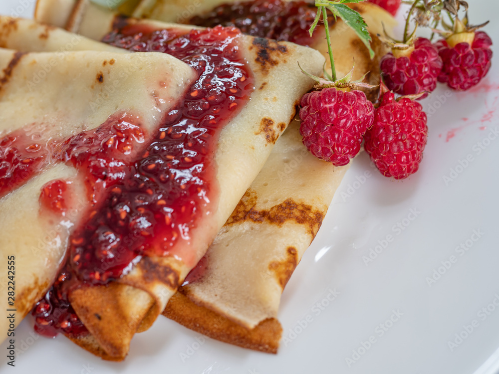 Homemade pancakes with raspberry jam. Copy space. Homemade pancakes with raspberry jam. Copy space.