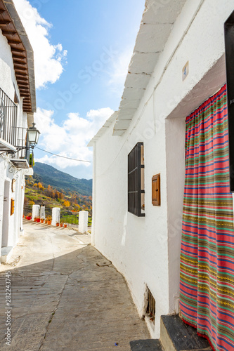 Capileira, Spain-November 15,2018:.house facade in the white village of Capileira in the Sierra Nevada,Spain photo