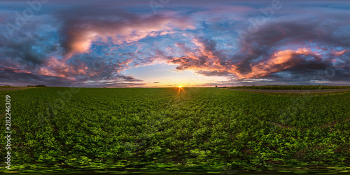 full seamless spherical hdri panorama 360 degrees angle view among fields in summer evening sunset with awesome blue pink red clouds in equirectangular projection, ready for VR AR virtual reality