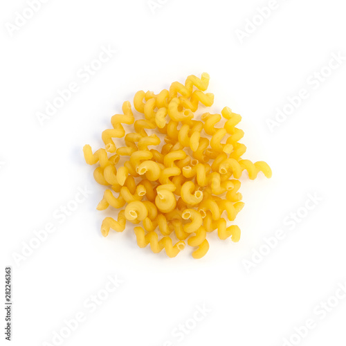 Raw pasta cellentani isolated over white background