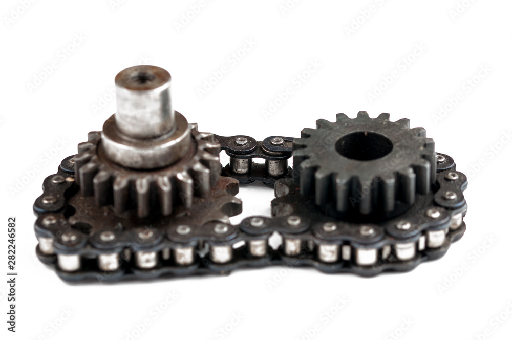 Driving roller chain and gear isolated on white background.Copy space Driving roller chain and gear isolated on white background.Copy space