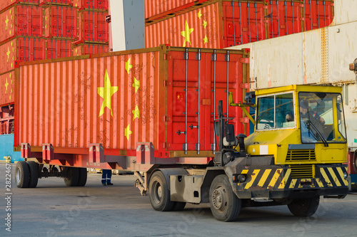 Photography cargo container with the china flag during unloading at the port