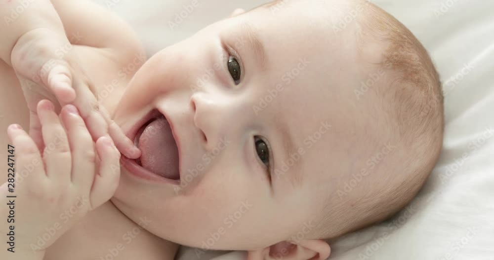 Closeup view of adorable little child on bed Closeup view of adorable little child on bed