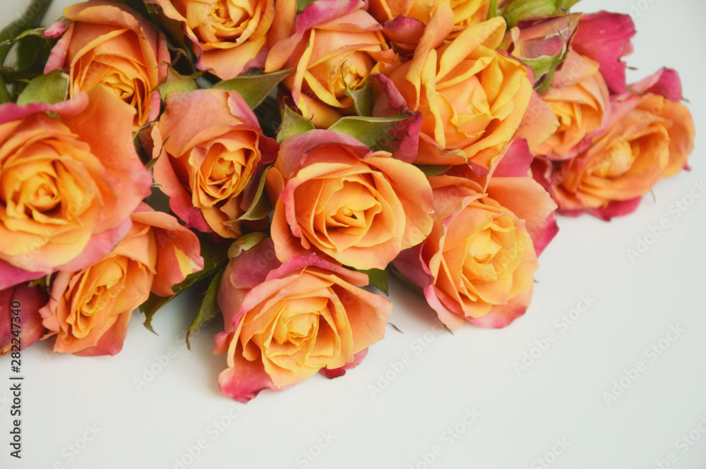 bouquet of beautiful pink and orange roses on a light background. bouquet of flowers.