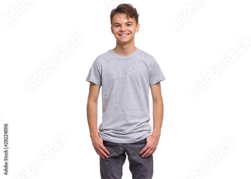 T-shirt design concept. Teen boy in blank gray t-shirt, isolated on white background. Mock up template for print. Happy child looking at camera, front view.