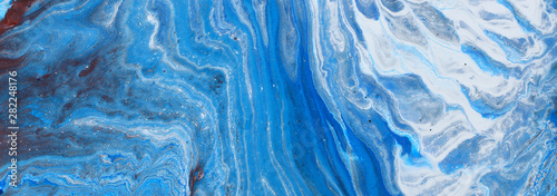photography of abstract marbleized effect background. Blue and white creative colors. Beautiful paint. banner © tomertu