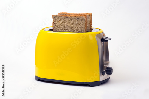 Photos yellow toaster on a white background