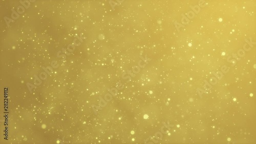 Gold sparkles, glitter particles on golden background, glowing dust flying in space