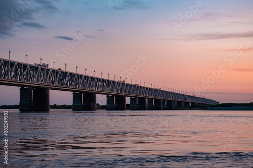 Bridge over the Amur river at sunset. Russia. Khabarovsk. Photo from the middle of the river.