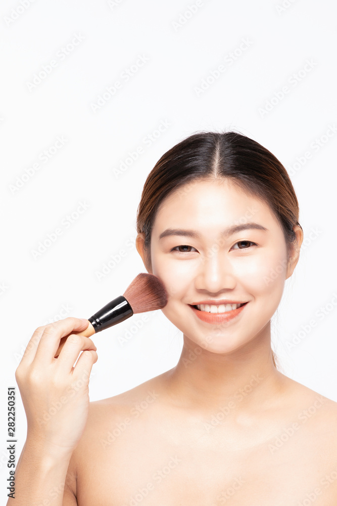 Beautiful Asian young woman smile and holding make up brush with healthy Clean and Fresh skin feeling so happiness and cheerful,Isolated on white background,Beauty Concept Beautiful Asian young woman smile and holding make up brush with healthy Clean and Fresh skin feeling so happiness and cheerful,Isolated on white background,Beauty Concept