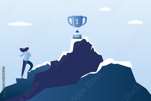 Businesswoman or office worker climbs a mountain,winner cup on top,